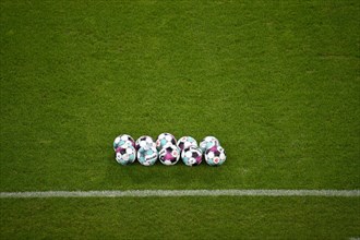 Adidas Derbystar match balls lie on grass