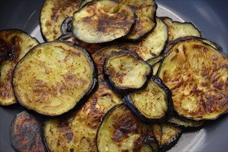 Roasted eggplant slices in frying pan