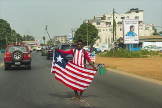 Man selling the flag of Liberia