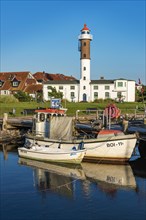 Fishing boats and lighthouse in the harbour of Timmendorf on the island of Poel