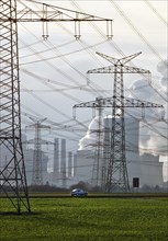 High-voltage pylons in front of the Neurath lignite-fired power plant