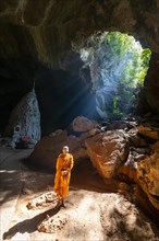Monk standing in Saddan cave