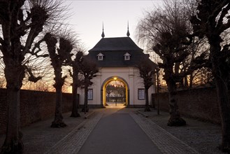 Gatehouse with tree avenue in the morning
