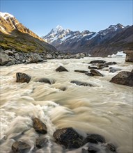 Hooker River in Hooker Valley with view of snow-capped Mount Cook