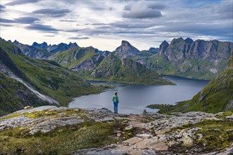 Hiker walks through mountain landscape