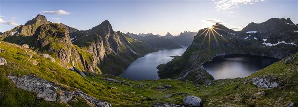 Sun shining over mountain landscape with fjord Forsfjorden and lake Krokvatnet