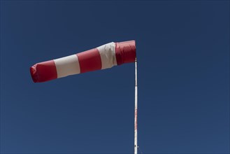 Inflated windsock in blue sky
