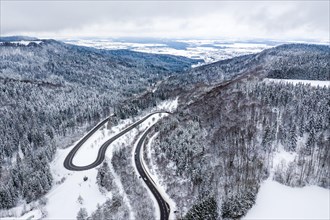 Winter snow road serpentine curves aerial photo near Albstadt curve