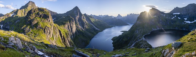 Hiker looking at mountain landscape with fjord Forsfjorden