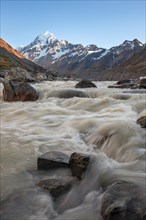 Hooker River in Hooker Valley with view of snow-capped Mount Cook