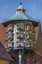 Artfully built dovecote in front of a farmhouse