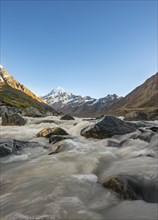 Hooker River in Hooker Valley with view of snow-capped Mount Cook