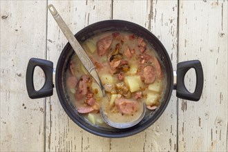 Traditional polish sour soup called zurek in a pot