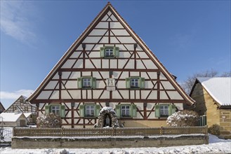 Historic Franconian farmhouse around 1880 with sculpture of the Virgin Mary