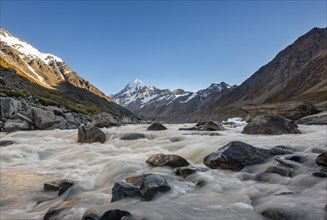 Hooker River in Hooker Valley with view of snow-capped Mount Cook