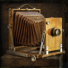 Old camera on brown background