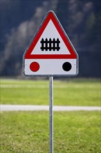 Traffic sign level crossing with barriers and traffic lights
