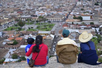 Indigenous family at the Cerro Santa Apolonia viewpoint overlooking the city