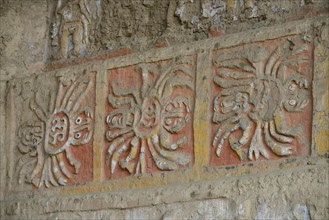 Colourful reliefs of the Moche culture on adobe walls