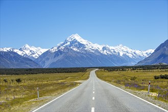 Country road overlooking snow-capped Mount Cook National Park