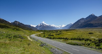 Country road overlooking snow-capped Mount Cook National Park
