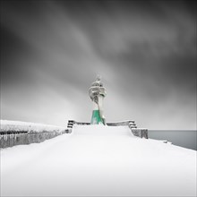 Iced lighthouse in the harbour of Sassnitz