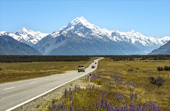 Campervan on country road overlooking snow-capped Mount Cook National Park