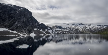 Snow and ice floating on lake Djupvatnet