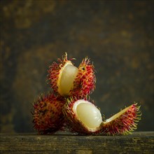 Rambutans on brown background