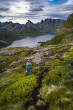 Hiker walks through mountain landscape