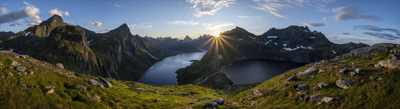 Sun shines over mountain landscape with fjord Forsfjorden and lake Krokvatnet