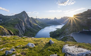 Sun shining over mountain landscape with fjord Forsfjorden and lake Krokvatnet
