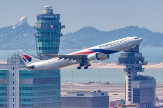 A Malaysia Airlines Airbus A330-300 aircraft with registration number 9M-MTB at Hong Kong Airport