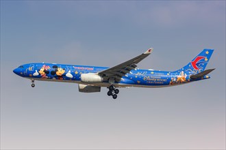 A China Eastern Airlines Airbus A330-300 with registration number B-6507 and special Disney Resort livery at Shanghai Hongqiao Airport
