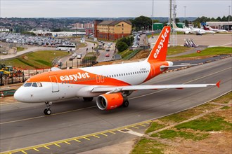 An EasyJet Airbus A319 with the registration G-EZAX at London Airport