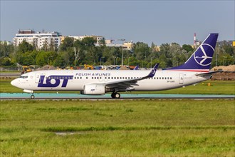 A Boeing 737-800 aircraft of LOT Polskie Linie Lotnicze with registration SP-LWB at Warsaw Airport