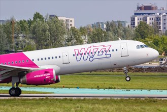An Airbus A321 aircraft of Wizzair with registration number HA-LXV at Warsaw Airport