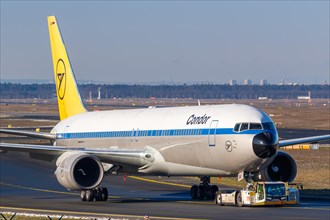 A Boeing 767-300ER aircraft of Condor with registration D-ABUM in the retro special livery at Frankfurt Airport