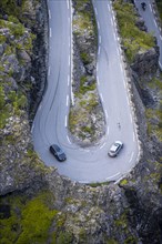 Cars in hairpin bends at the mountain road Trollstigen