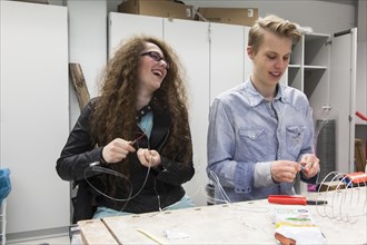 Students in the design class make a work of art with wire