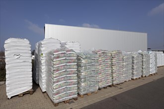 Stacked bags of potting soil and garden mulch for the spring shop