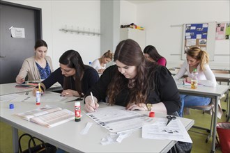 Vocational school students in class of the vocational training to become a beautician. Dual system at the Elly-Heuss-Knapp-Schule