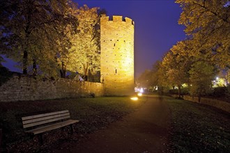 Illuminated Kattentor with city wall in the evening