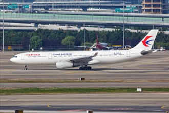 An Airbus A330-300 of China Eastern Airlines with registration number B-5953 at Shanghai Airport