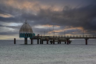 Diving gondola and pier at the beach of Zingst at sunrise