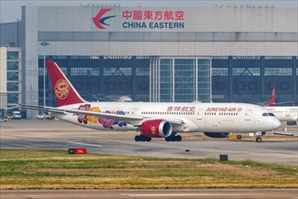 A Boeing 787-9 Dreamliner aircraft operated by Juneyao Air with registration number B-209R at Shanghai Airport