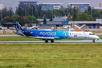 A Bombardier CRJ-900 aircraft of Nordica with registration number ES-ACB at Warsaw Airport