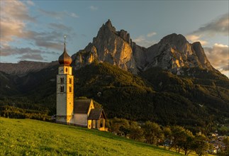 Church San Valentino in the evening light in front of the Schlern