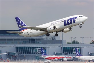 A Boeing 737-400 aircraft of LOT Polskie Linie Lotnicze with registration SP-LLG at Warsaw Airport