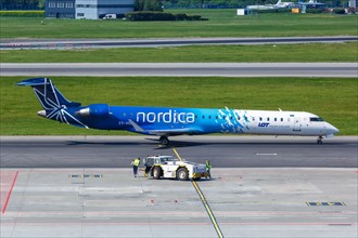 A Bombardier CRJ-900 aircraft of Nordica with registration number ES-ACB at Warsaw Airport
